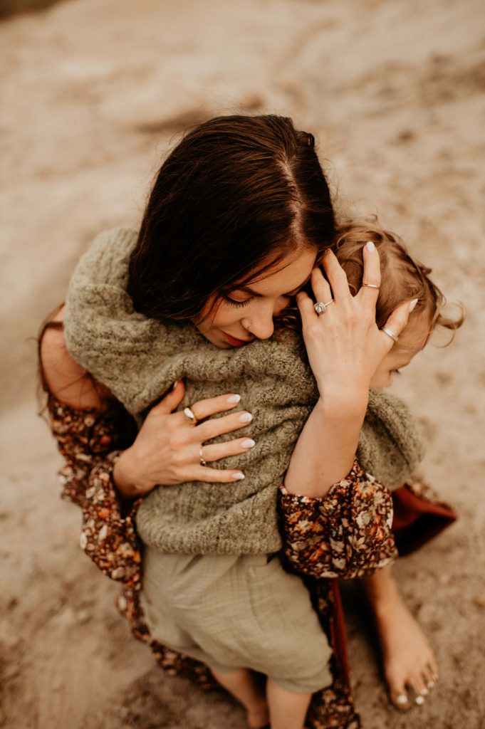mother hugging toddler