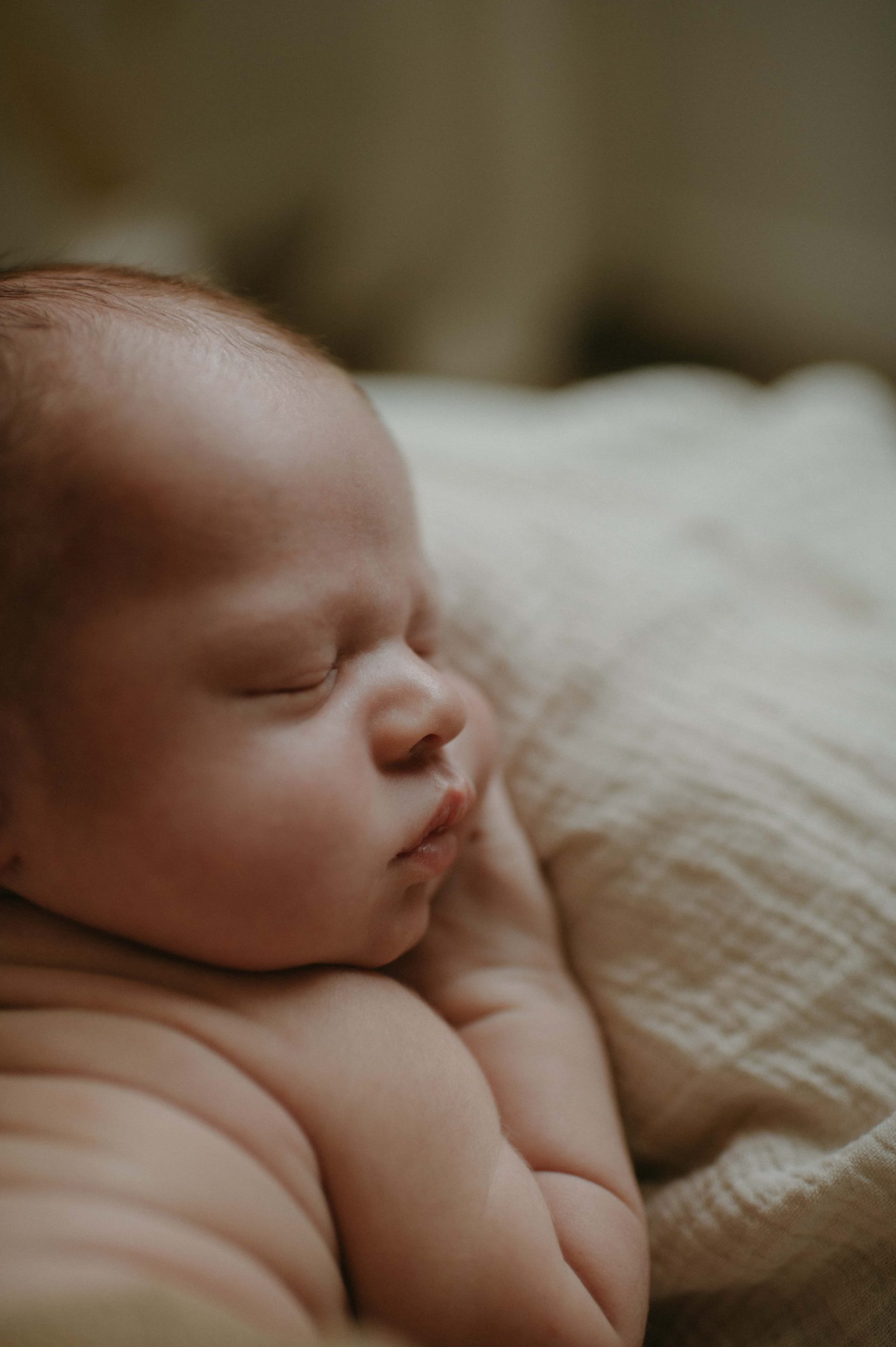 close up of newborn baby posed