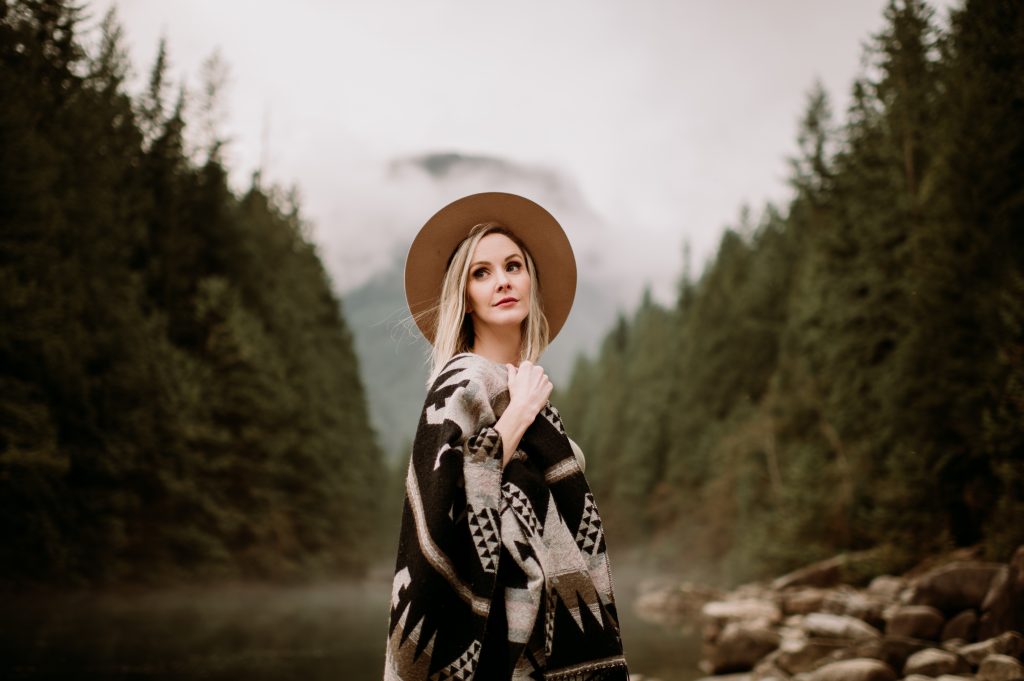 girl standing in front of mountains and trees lower mainland bc