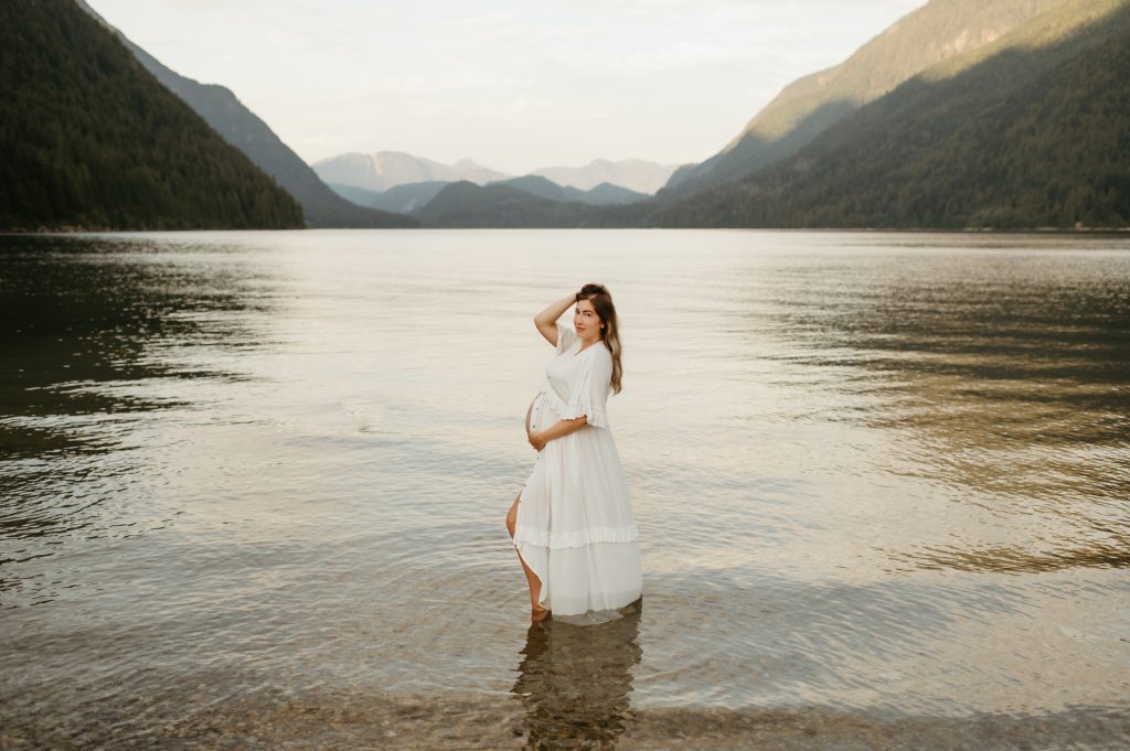 pregnant woman standing in lake alouette lake bc, best photography locations
