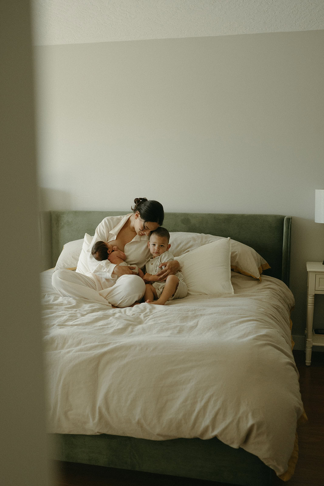 in-home newborn photography session mom and baby